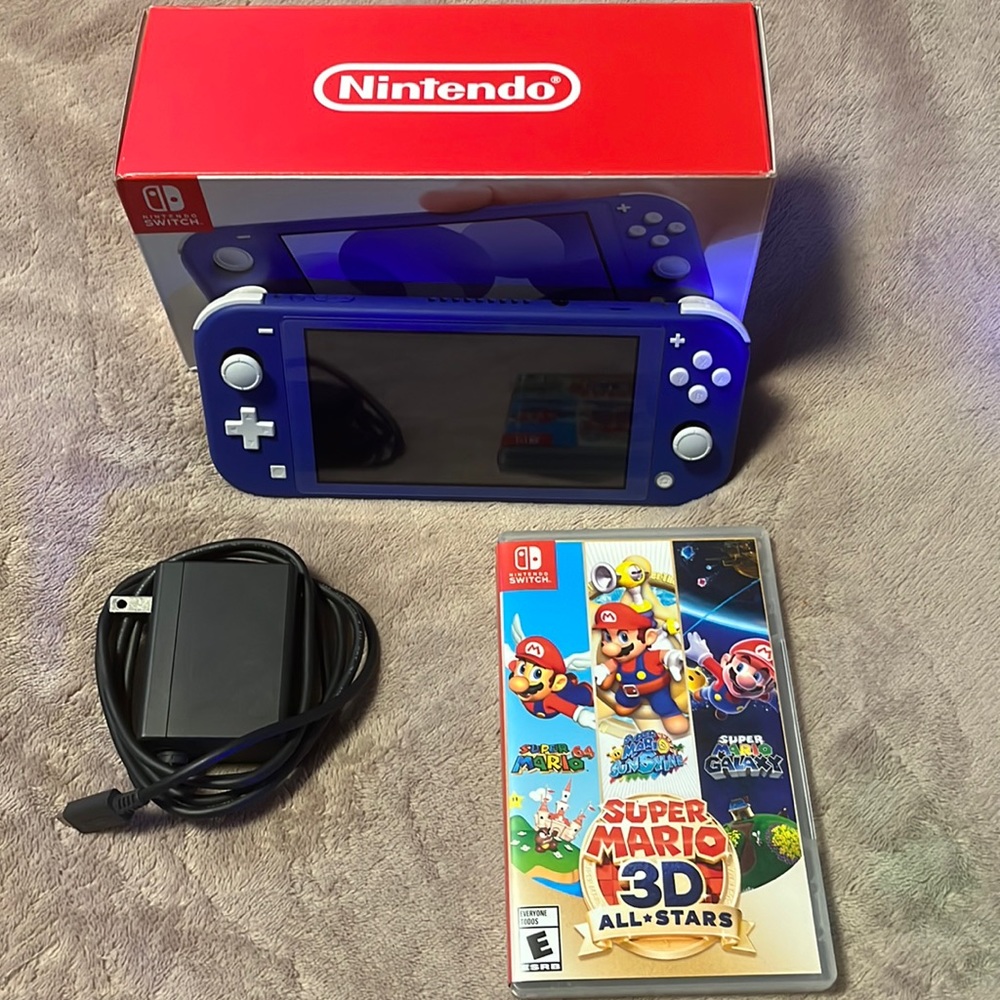 Slightly used Nintendo Switch Lite Blue.